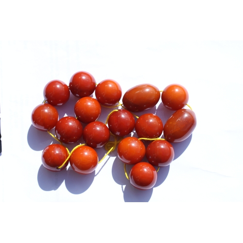 523 - A butterscotch Bakelite amber bead necklace, the largest bead approx 3cms long.