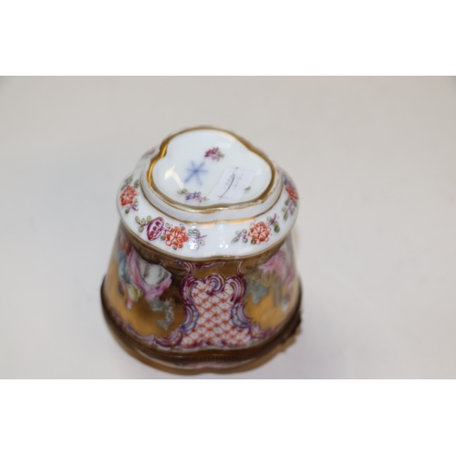 310 - A continental porcelain box and cover decorated with classical figures, 9.5cms high; together with t... 