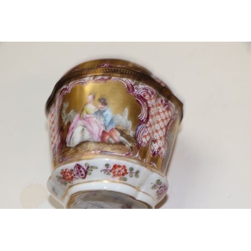 310 - A continental porcelain box and cover decorated with classical figures, 9.5cms high; together with t... 