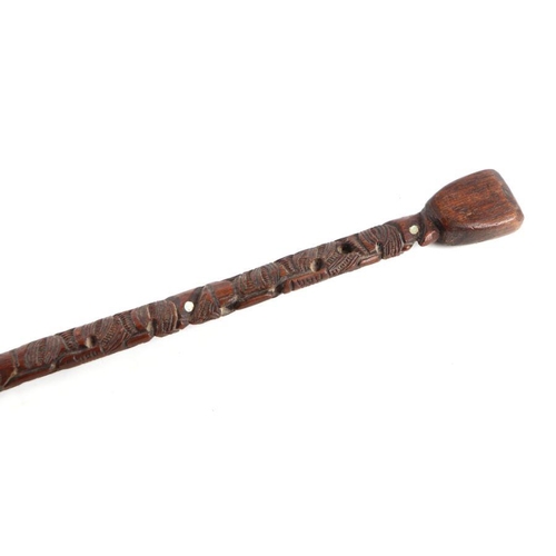 101 - A Maori carved hardwood walking stick, the shaft carved with Koruru (owl), 86cms long.