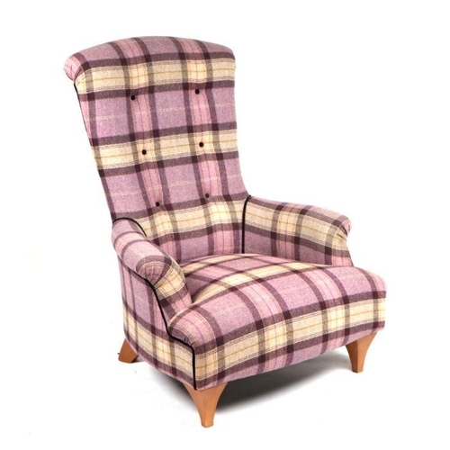 1050 - A John Sankey button backed armchair upholstered in tartan design fabric.