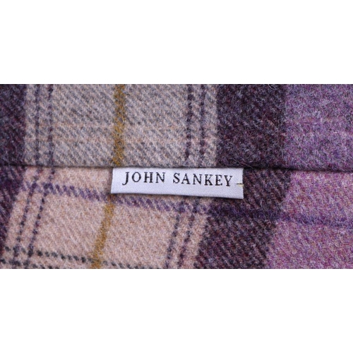 1050 - A John Sankey button backed armchair upholstered in tartan design fabric.