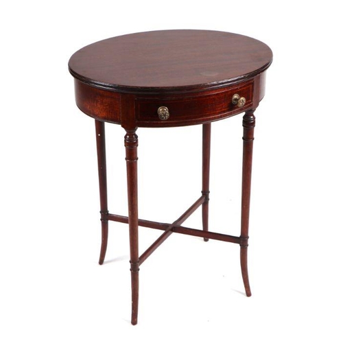 1053 - A George III style mahogany oval occasional table with single frieze drawer, on slender ring turned ... 