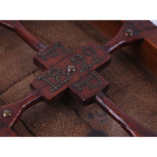 1058 - A 19th century provincial oak footstool with needlework cover, tapering legs terminating in circular... 