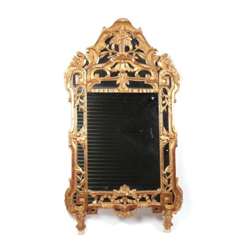 1065 - A Florentine style carved giltwood wall mirror, 69cms wide.