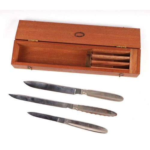 107 - A set of three 19th century Down Brothers, London, surgeons knives,cased; together with another simi... 