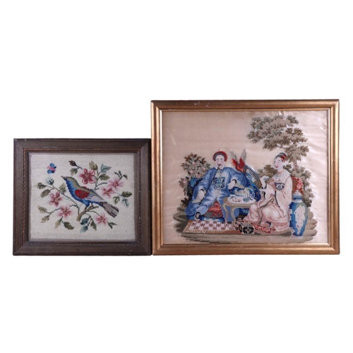 165 - A 19th century woolwork picture depicting a seated Oriental Lady and Gentleman, framed & glazed,... 