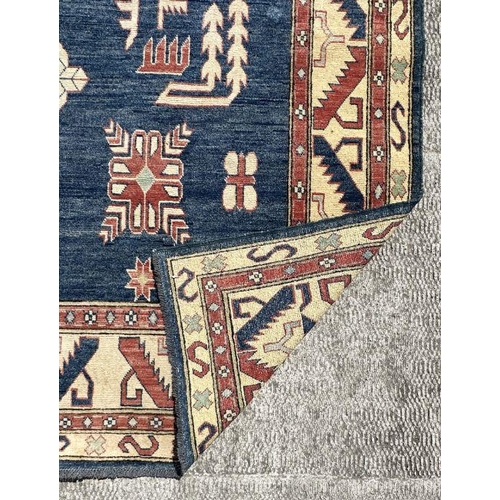 169 - A Pakistan hand knotted rug with geometric Kazak design, 386 by 262cms.