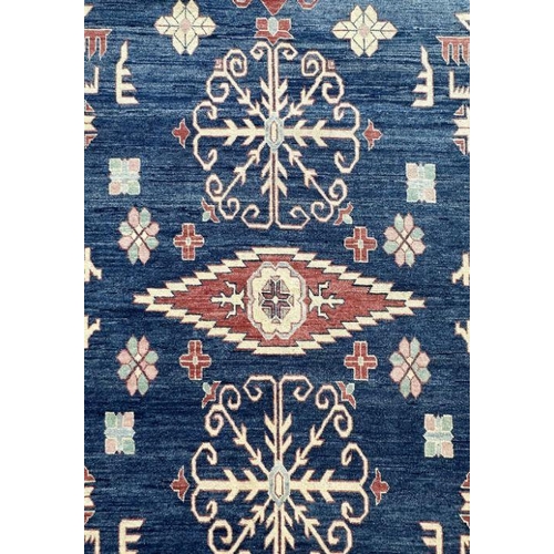 169 - A Pakistan hand knotted rug with geometric Kazak design, 386 by 262cms.