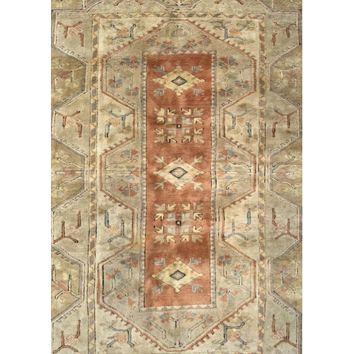 176 - A Persian hand knotted rug decorated with a geometric pattern on a beige ground, 196 by 281cms.