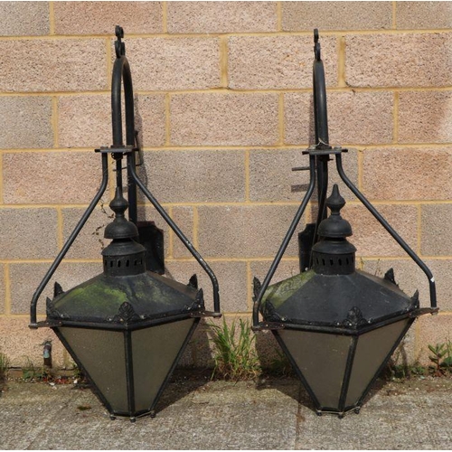 22 - A large pair of outside wall lanterns of octagonal form, on wall brackets, approx 80cms high (2).