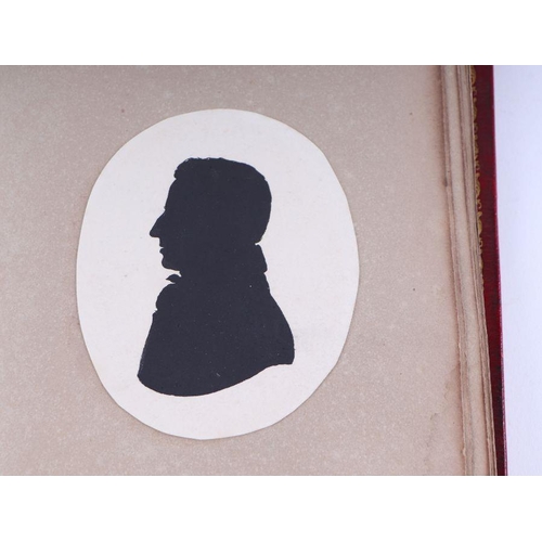 27 - An early 19th century tooled red leather album containing family silhouettes and numerous signatures... 