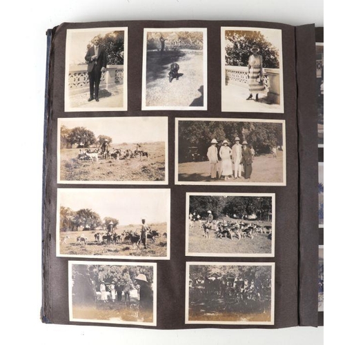 43 - An early 20th century family photo album depicting images of cars, military, topographical subjects ... 