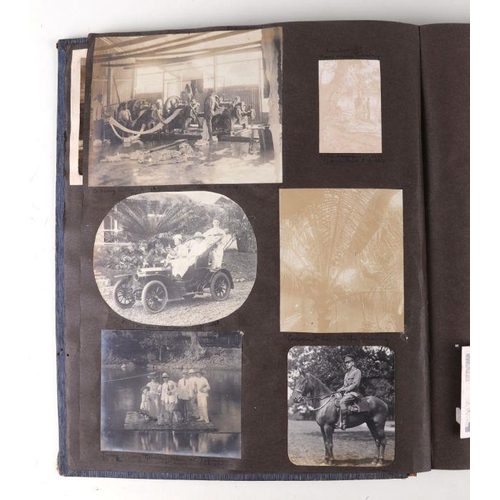 43 - An early 20th century family photo album depicting images of cars, military, topographical subjects ... 