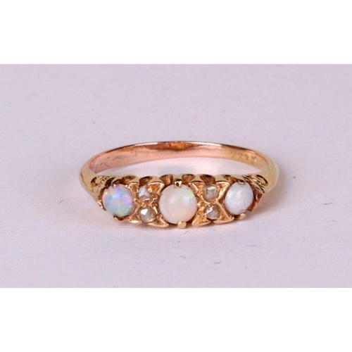 527 - A yellow metal opal and diamond ring, approx UK size 'L', 2.9g.