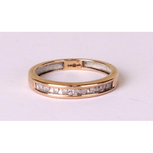 533 - A 9ct gold diamond set half eternity ring, approx UK size 'J', 1.5g.