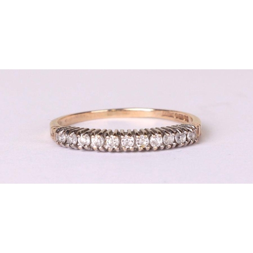 536 - A 9ct gold diamond set half eternity ring, approx UK size 'Q', 1.4g.