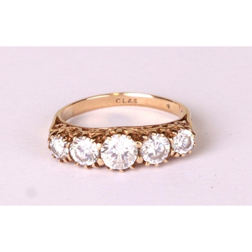 537 - A 9ct gold and five white stone ring, approx UK size 'K', 2.5g.