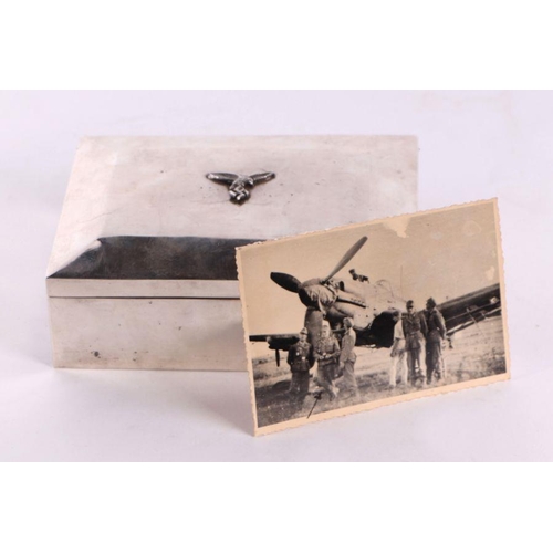 68 - A WWII continental silver (stamped 800) German Luftwaffe cigarette box, 16cms wide; together with a ... 