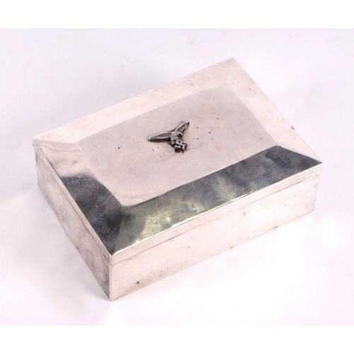 68 - A WWII continental silver (stamped 800) German Luftwaffe cigarette box, 16cms wide; together with a ... 