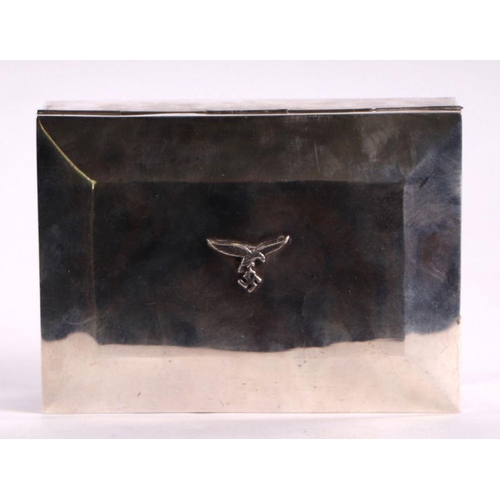 68 - A WWII continental silver (stamped 800) German Luftwaffe cigarette box, 16cms wide; together with a ... 