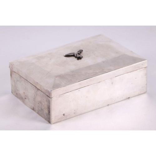 68 - A WWII continental silver (stamped 800) German Luftwaffe cigarette box, 16cms wide; together with a ... 