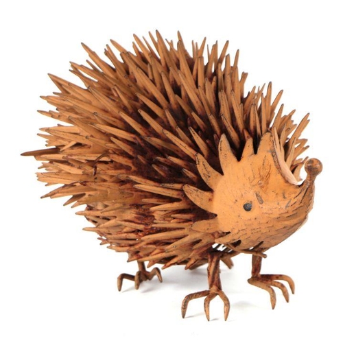 7 - A weathered painted metal garden ornament in the form of a hedgehog, 35cms long.