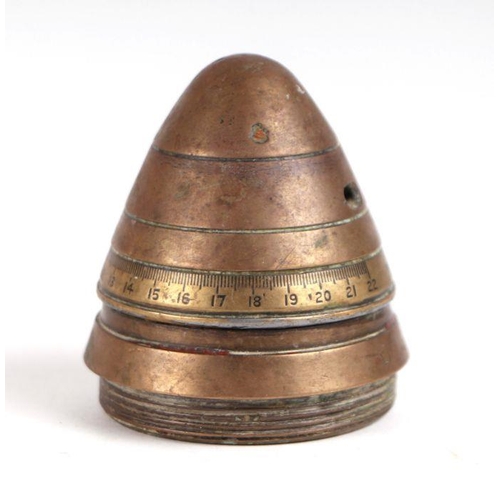 86 - An inert brass shell head, 7cms diameter; together with three brass shell cases, largest 30cms high ... 