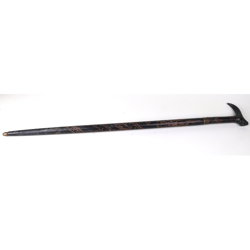 52 - An Anglo-Indian sword stick with carved decoration, 95cms long, blade length 46cms.