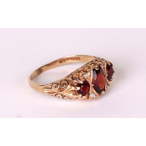 525A - A 9ct gold garnet and diamond ring, approx UK size 'P', 3.1g.