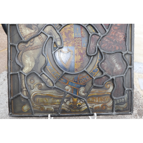 287 - A leaded glass window panel hand painted with the Royal Standard, 38 by 48cms.