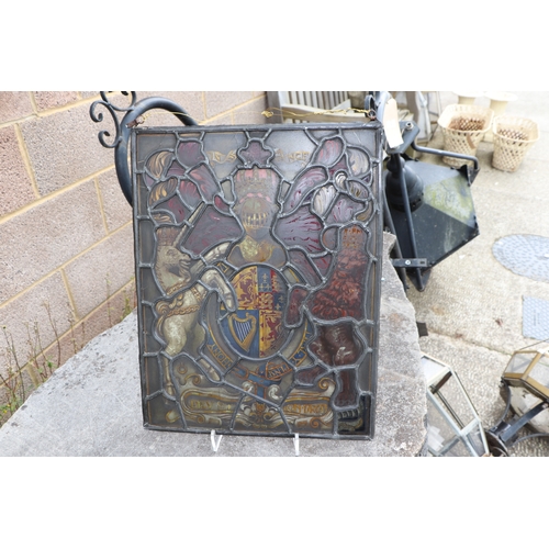 287 - A leaded glass window panel hand painted with the Royal Standard, 38 by 48cms.