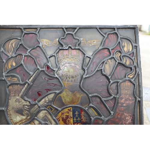 287 - A leaded glass window panel hand painted with the Royal Standard, 38 by 48cms.