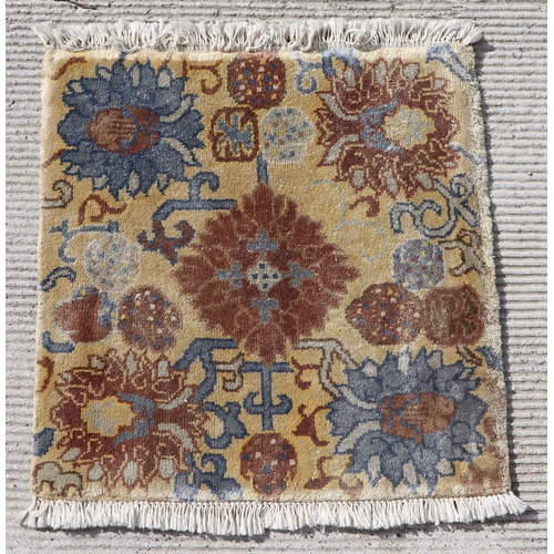 174 - A Tibetan saddle blanket; together with three Tibetan hand knotted meditation rugs, the largest 88 b... 