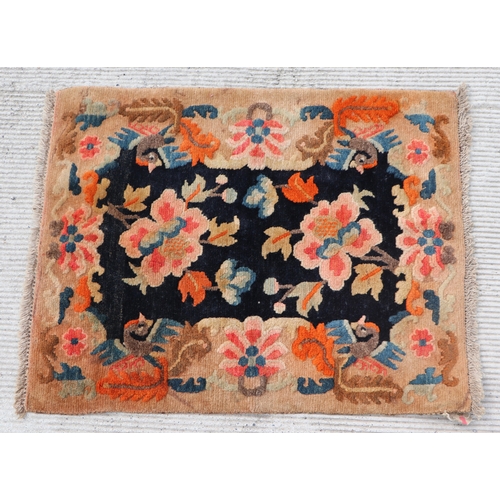 174 - A Tibetan saddle blanket; together with three Tibetan hand knotted meditation rugs, the largest 88 b... 