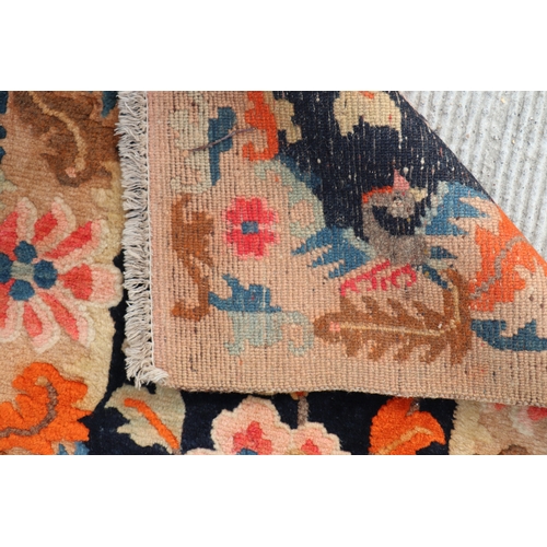 174 - A Tibetan saddle blanket; together with three Tibetan hand knotted meditation rugs, the largest 88 b... 