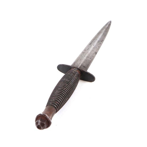 113 - A Fairbairn Sykes style fighting knife with leather scabbard, 30cms long.