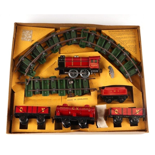 119 - A Chad Valley clockwork tinplate train set containing locomotive and tender, 0-4-0, in LMS livery; t... 