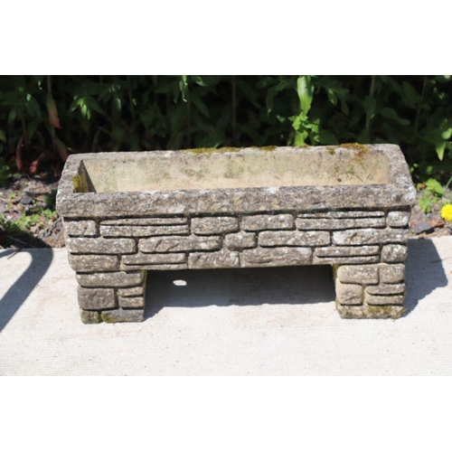 12 - A three-piece reconstituted stone rectangular garden planter, 67cms wide.