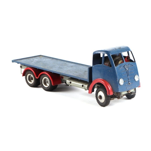 120 - A Shackleton Foden flatbed lorry with clockwork motor, blue cab and flatbed with red wings and chass... 