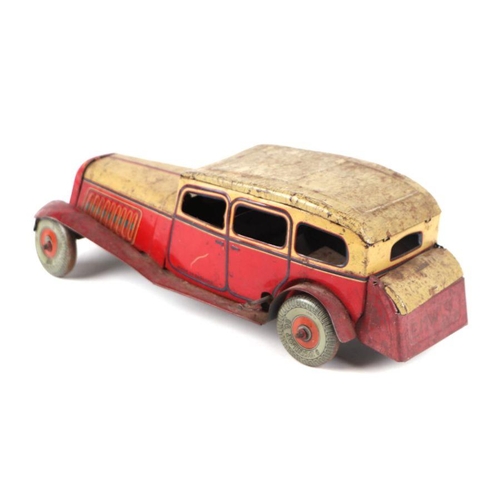 121 - A Mettoy clockwork tinplate sedan car with Dunlop 90 printed wheels, 28cms long.