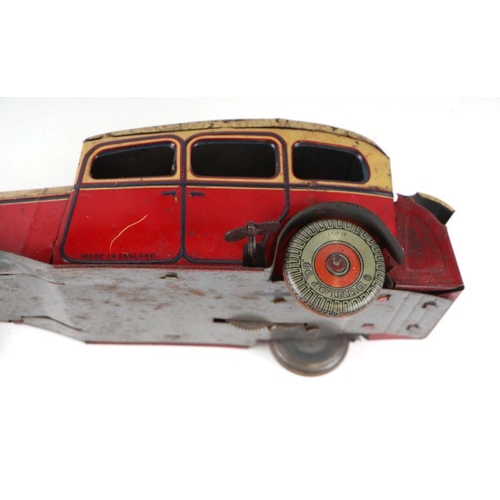 121 - A Mettoy clockwork tinplate sedan car with Dunlop 90 printed wheels, 28cms long.