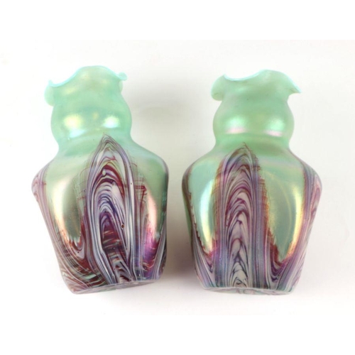 219 - A pair of Art glass vases of waisted form with crimped rims and dimpled sides, 20cms high (2).