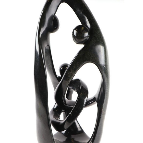 310 - Ngoni Mrewa (Zimbabwe school) - a large soapstone abstract figural sculpture, signed to the base, 70... 