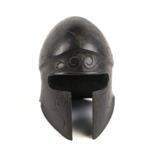 353 - An ancient Greek style Spartan Corinthian miniature bronze helmet, 7.5cms diameter.