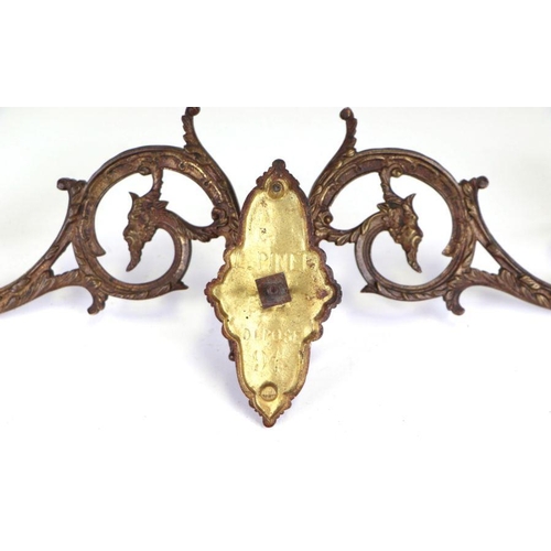 358 - A pair of 19th century French L. Pinet gilt metal twin-arm piano sconces decorated with green man ma... 