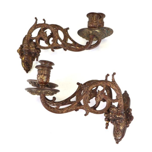 358 - A pair of 19th century French L. Pinet gilt metal twin-arm piano sconces decorated with green man ma... 