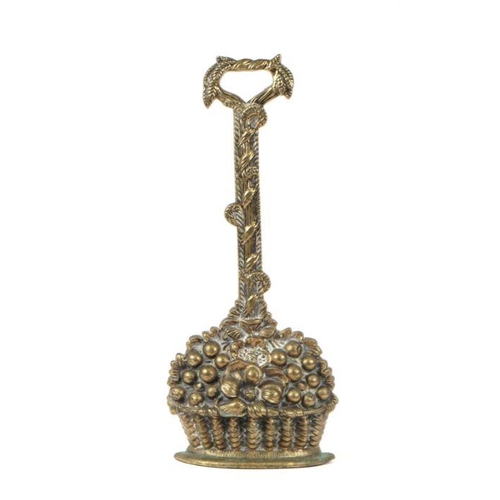 360 - A 19th century brass door porter in the form of a basket of fruit, 37cms high.