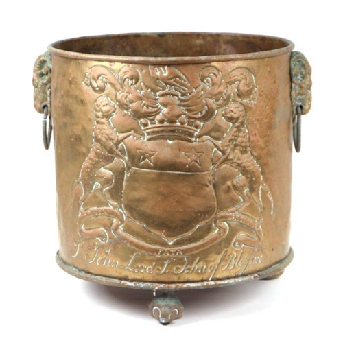 361 - A large brass log bin decorated in relief with the family crest of John Lord of Bletso, 39cms high; ... 