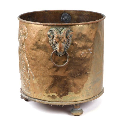 361 - A large brass log bin decorated in relief with the family crest of John Lord of Bletso, 39cms high; ... 